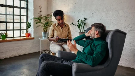 man-discusses-issues-with-therapist_579247-3232